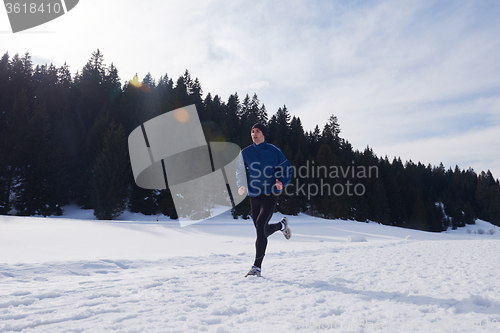 Image of jogging on snow in forest