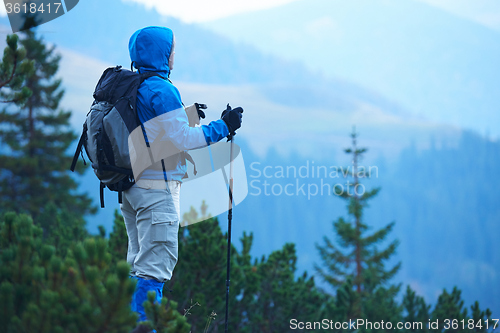 Image of advanture man with backpack hiking