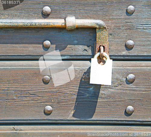 Image of europe old in  italy  antique close brown door and rusty lock  c