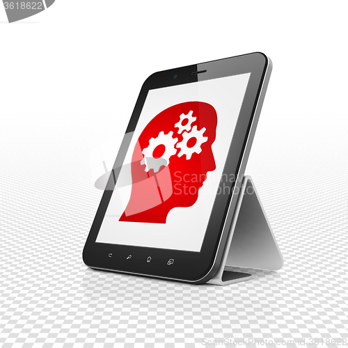 Image of Business concept: Tablet Computer with Head With Gears on display