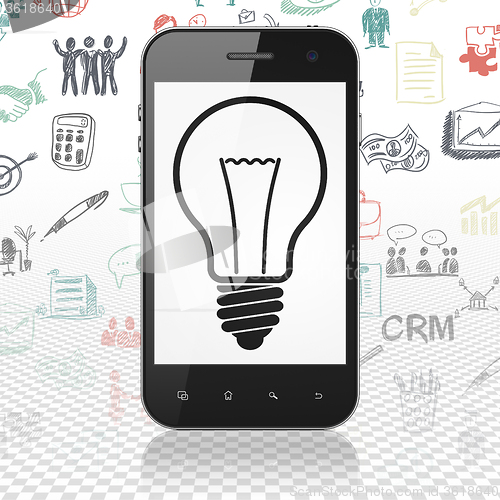 Image of Business concept: Smartphone with Light Bulb on display