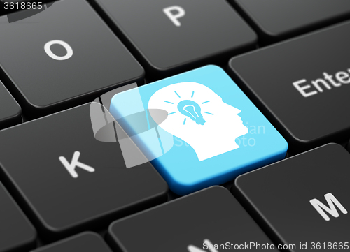Image of Finance concept: Head With Light Bulb on computer keyboard background
