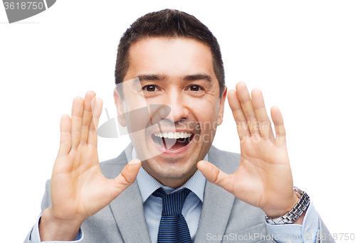 Image of happy businessman in suit shouting