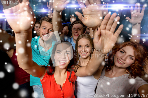 Image of smiling women dancing in club