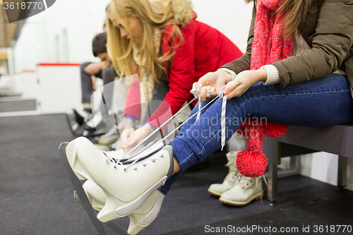 Image of close up of woman wearing skates on skating rink