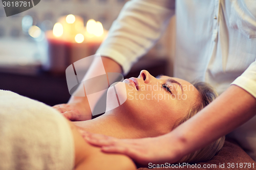 Image of close up of woman lying and having massage in spa