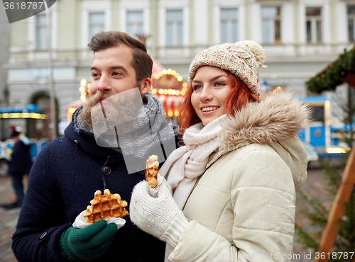 Image of happy couple walking in old town