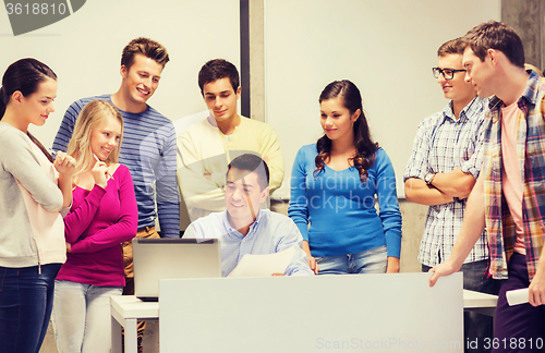 Image of group of students and teacher with laptop