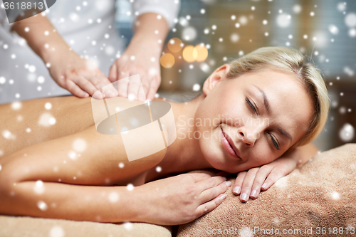 Image of close up of woman having back massage in spa