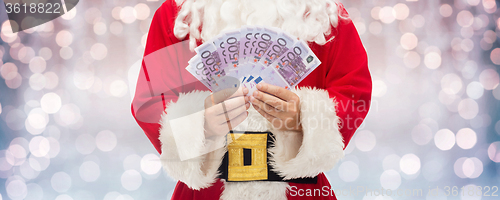 Image of close up of santa claus with euro money