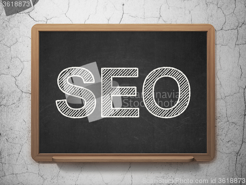 Image of Web design concept: SEO on chalkboard background