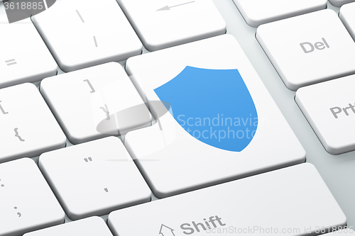 Image of Safety concept: Shield on computer keyboard background