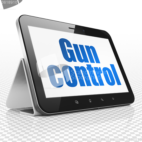 Image of Security concept: Tablet Computer with Gun Control on display