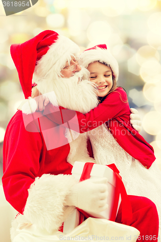 Image of smiling little girl with santa claus