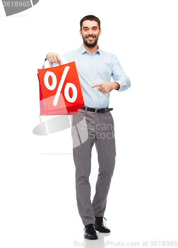 Image of smiling man with red shopping bag