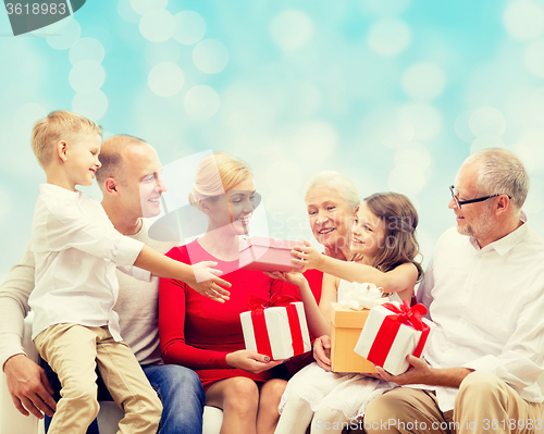 Image of smiling family with gifts