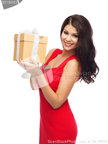 Image of beautiful sexy woman in red dress with gift box