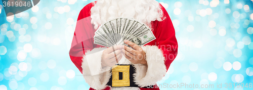 Image of close up of santa claus with dollar money