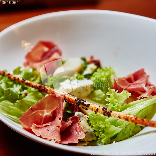 Image of salad italian style with prosciutto