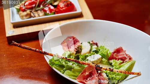 Image of salad italian style with prosciutto