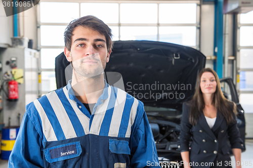 Image of Portrait of a confident mechanic in a garage