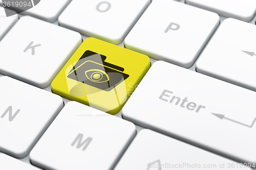 Image of Finance concept: Folder With Eye on computer keyboard background