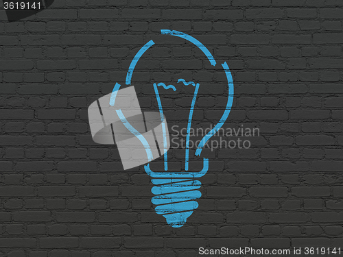 Image of Business concept: Light Bulb on wall background