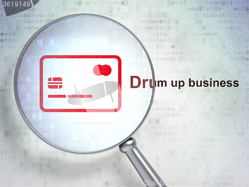 Image of Business concept: Credit Card and Drum up business with optical glass
