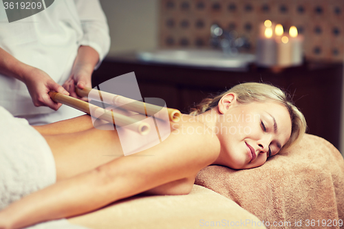 Image of close up of woman lying and having massage in spa