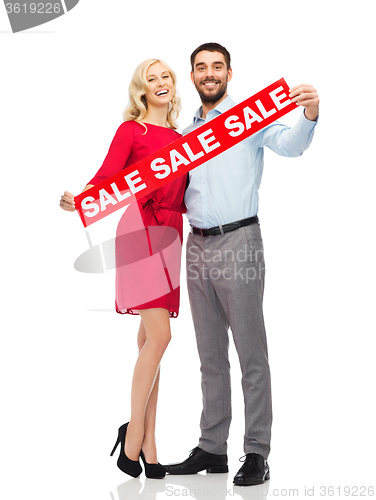 Image of happy couple with red sale sign