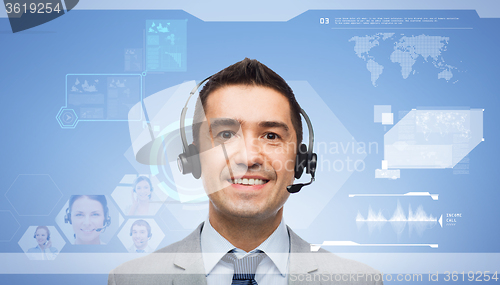Image of smiling businessman in headset over virtual screen