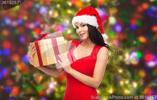 Image of beautiful sexy woman in santa hat with gift box