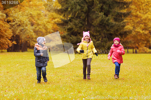 Image of group of happy little kids running outdoors