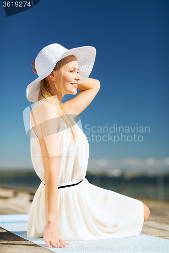 Image of beautiful woman enjoying summer outdoors