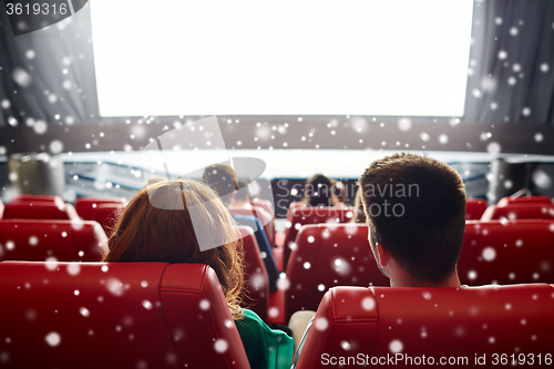 Image of couple watching movie in theater or cinema