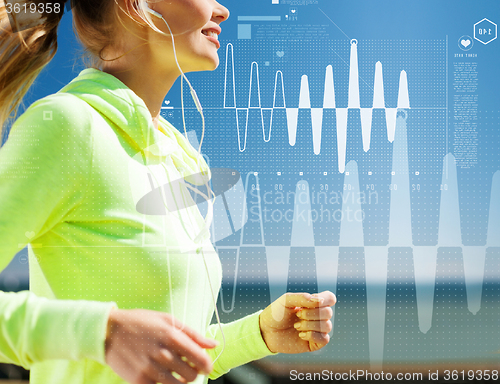 Image of smiling woman doing running outdoors
