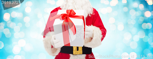 Image of close up of santa claus with gift box