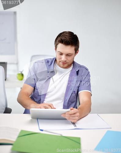 Image of high school student with tablet pc in classroom