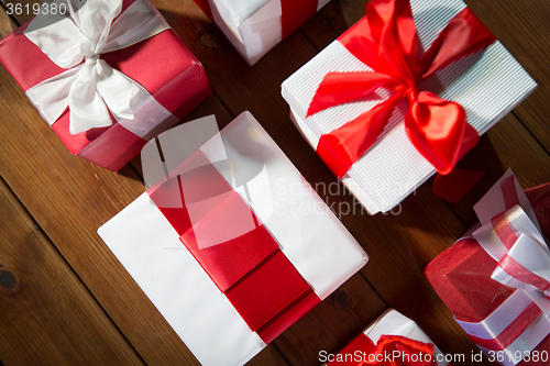 Image of close up of gift boxes on wooden floor from top