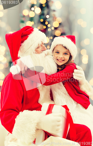 Image of smiling little girl with santa claus