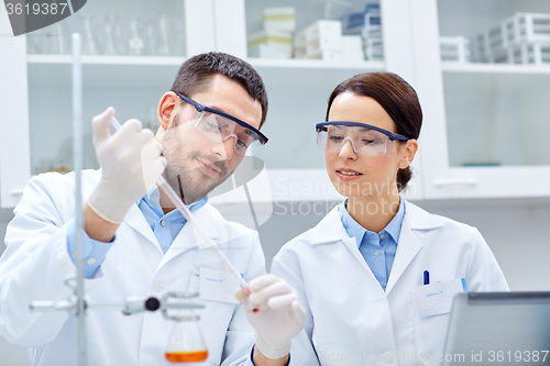 Image of young scientists making test or research in lab