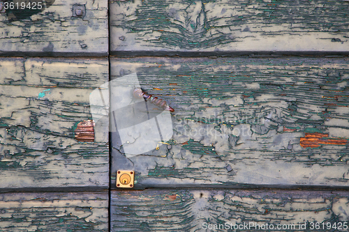 Image of   sumirago cross    brown knocker in a     wood door   varese it