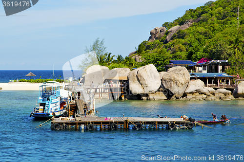 Image of   beach    rocks house boat in thailand   
