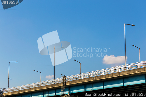 Image of Bridge over water with lamp pole