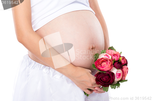 Image of Pregnant woman hold with flower