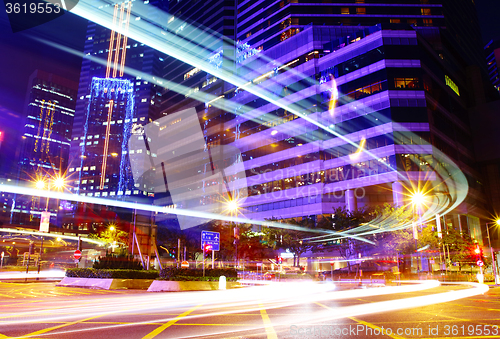 Image of Fast moving car trail in city at night