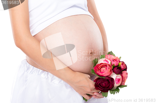Image of Pregnant woman hold with flower