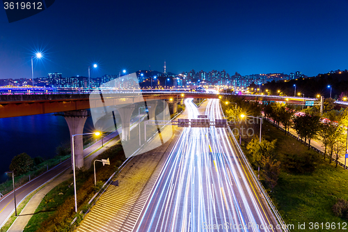 Image of Light trails from vehicles on motorway at night seoul