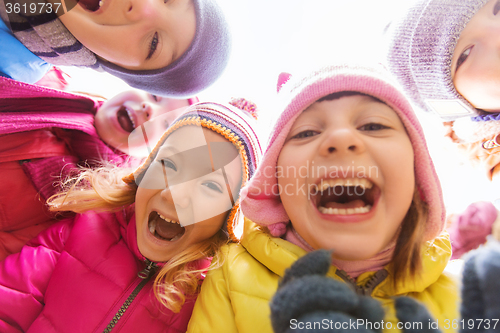 Image of group of happy children faces in circle