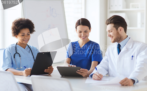 Image of group of happy doctors meeting at hospital office